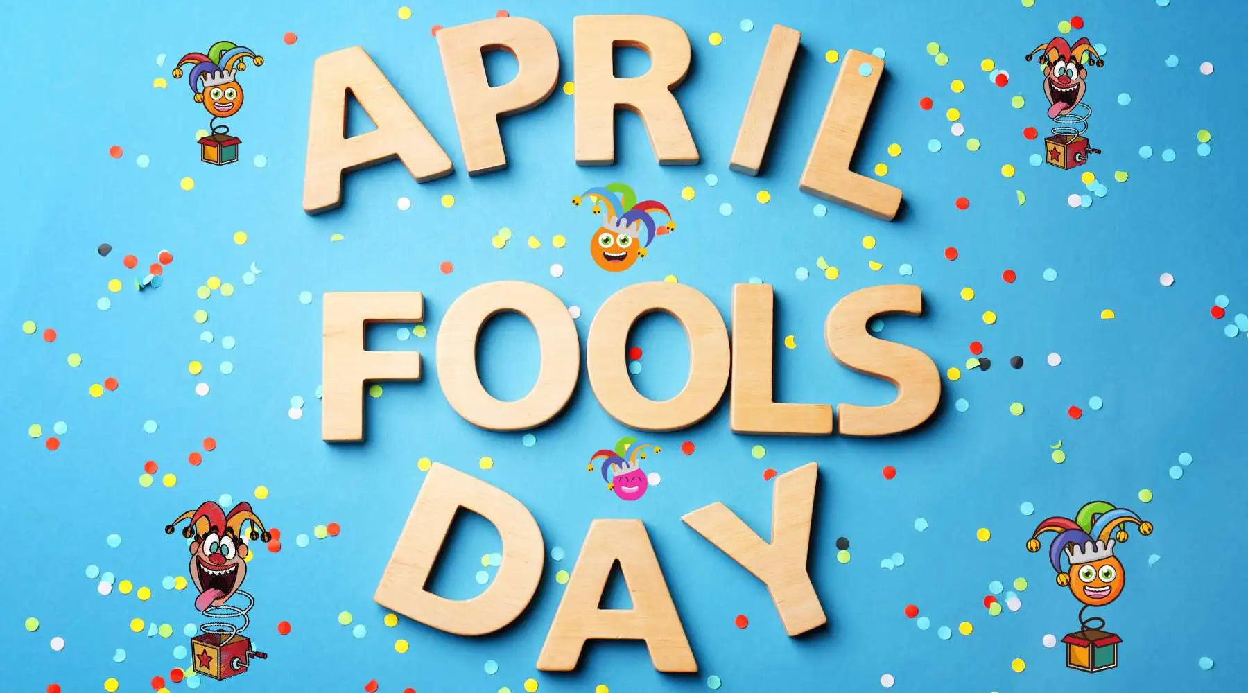 Wooden letters spell ‘APRIL FOOLS DAY’ on blue background with confetti and jester graphics