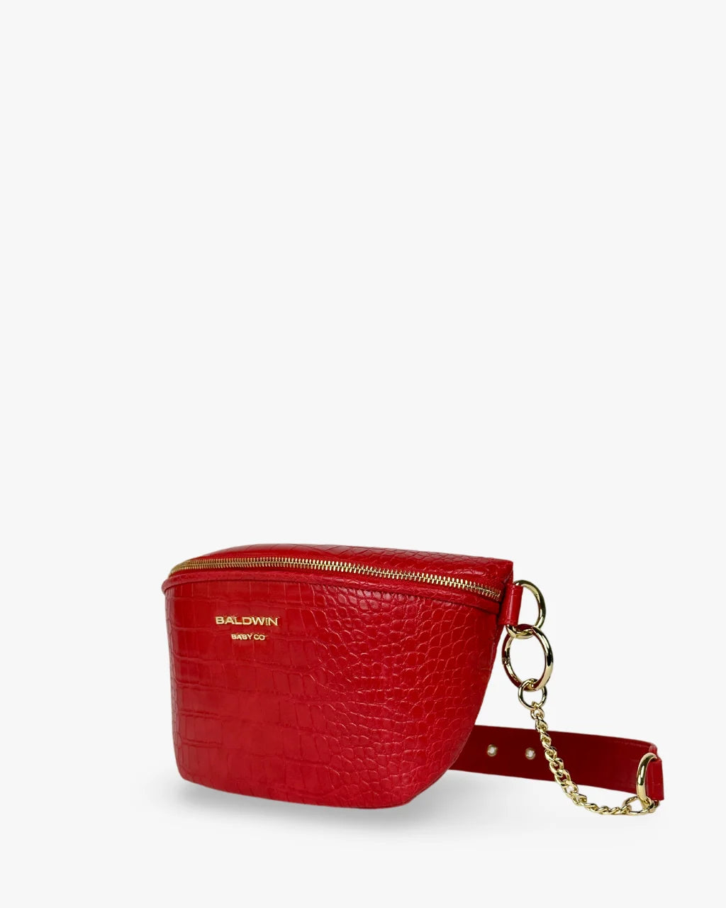 Angled view of red faux croc belt bag with zip top, gold hardware, and logo embossing