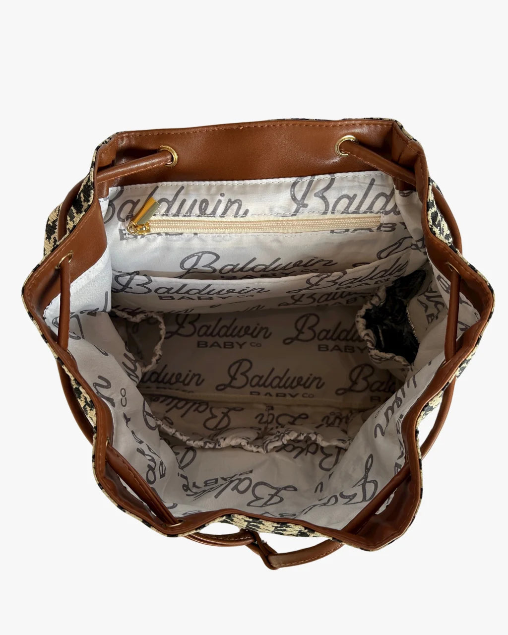 Inside houndstooth diaper backpack with Baldwin Baby Co lining and compartments