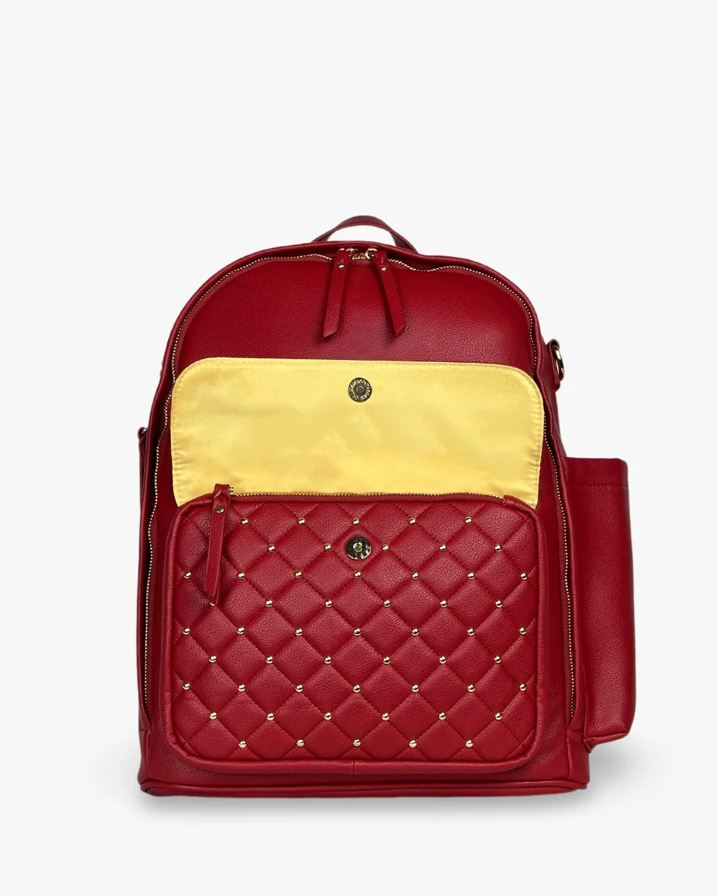 Close-up of red diaper bag flap with tan lining, gold studs, and hidden zip pocket