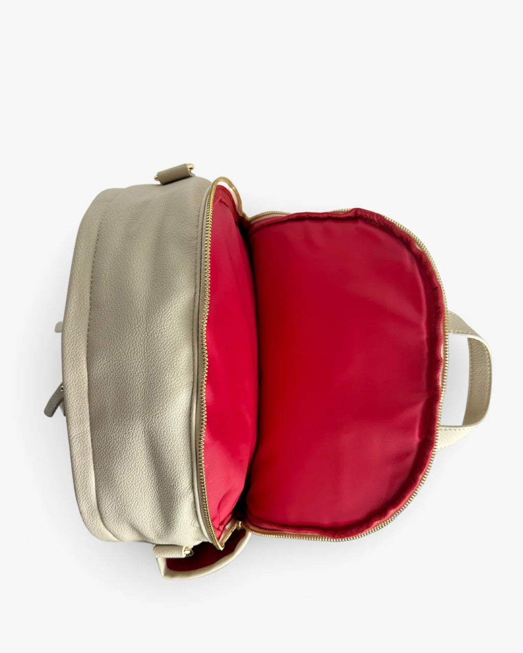 Top-down view of the gray-beige diaper backpack featuring a padded laptop compartment with vibrant red lining