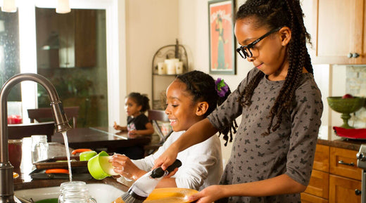 two girls washing the dishes