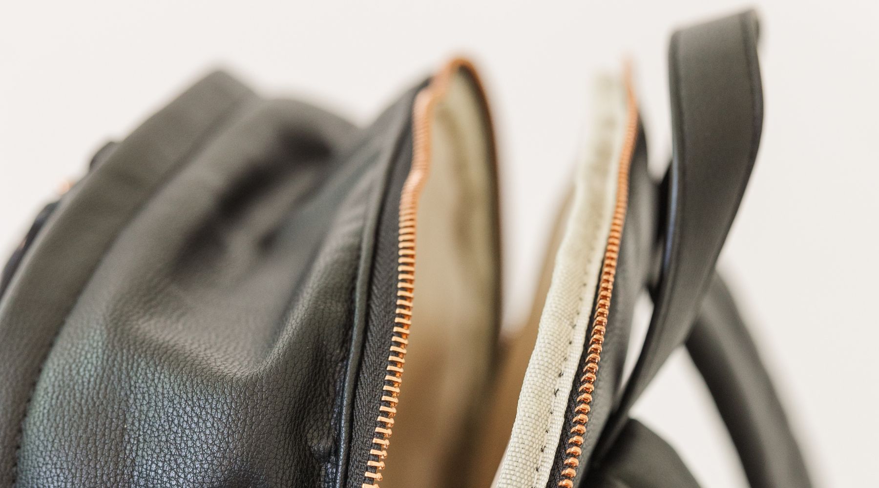 Black leather backpack unzipped