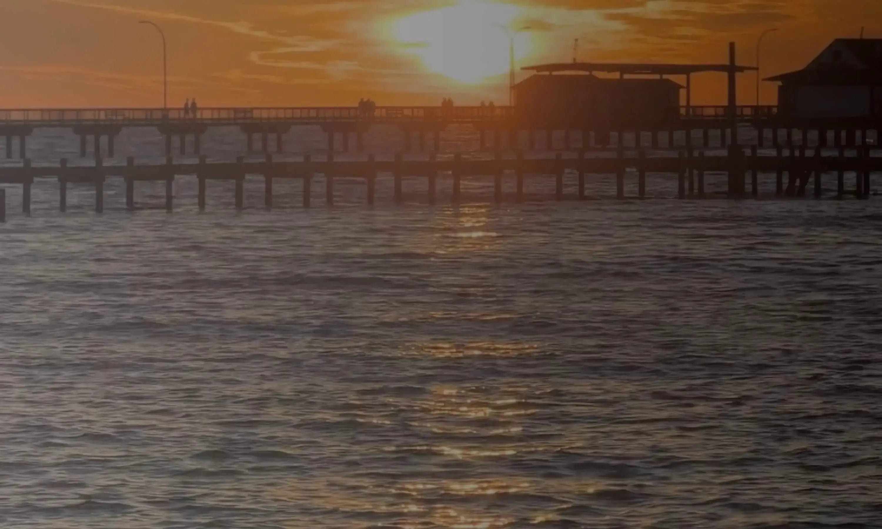 sun setting of coastal piers