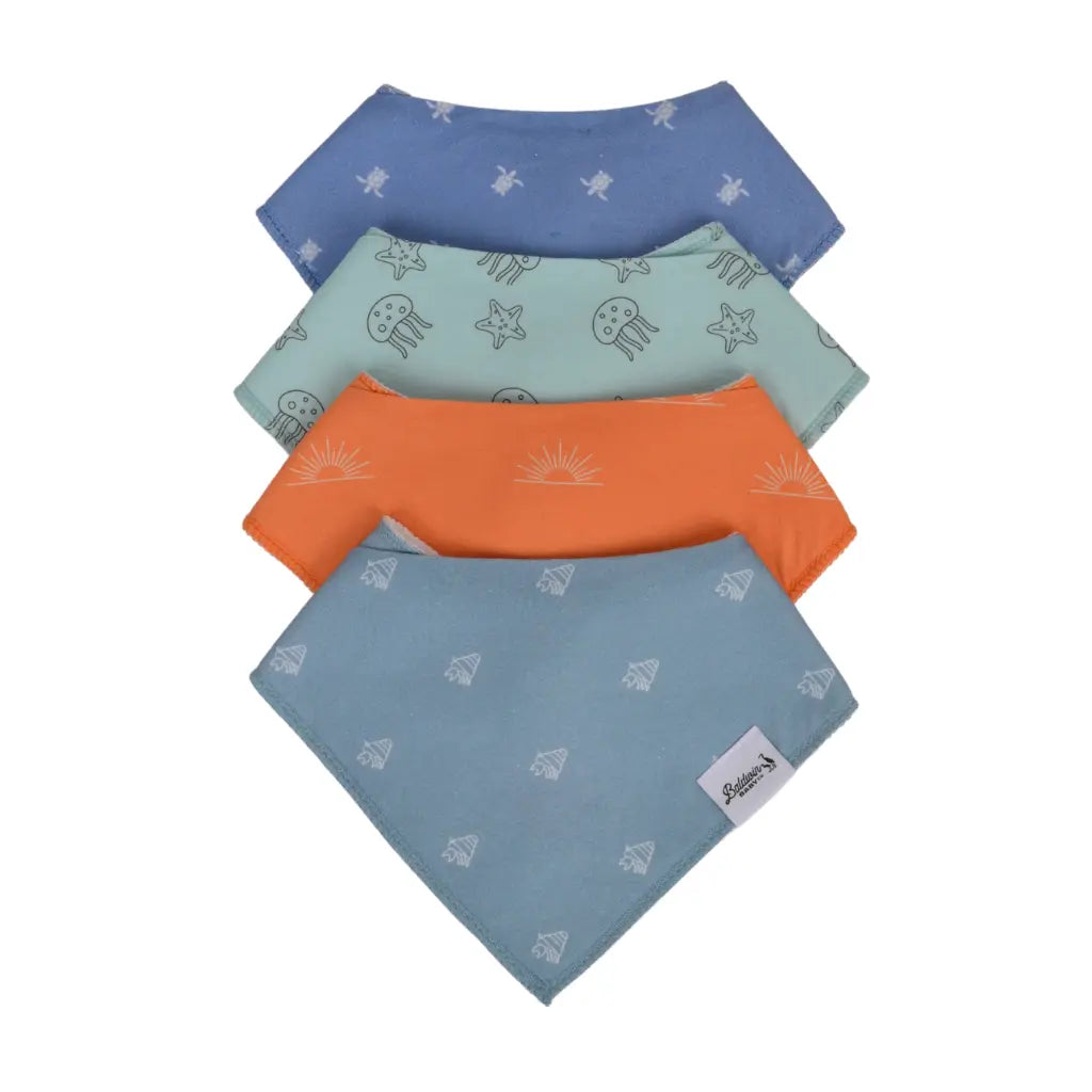 Set of four sea creature pattern bandana bibs on a white background