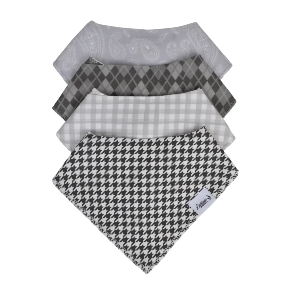 Set of four classic pattern style bandana bibs on a white background