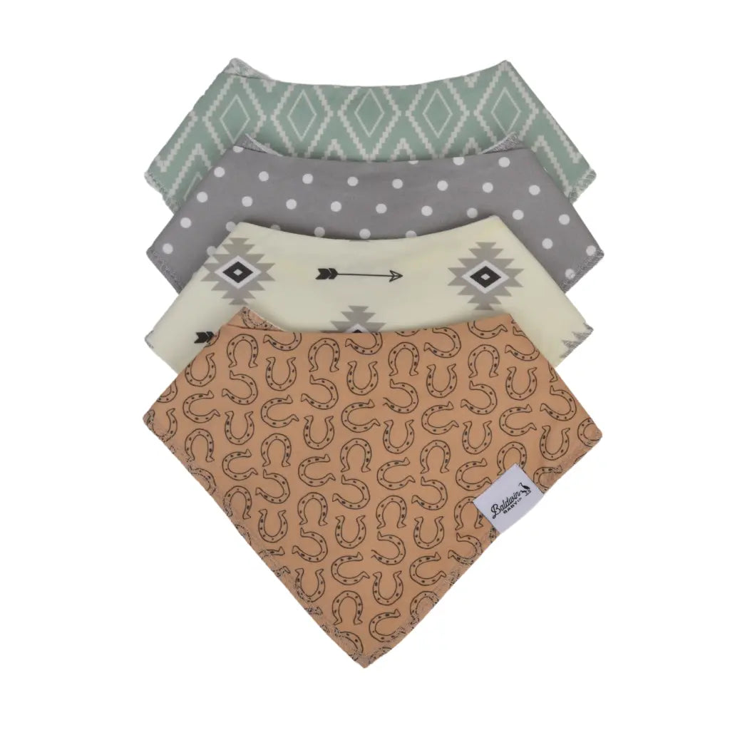 Set of four Western-style bandana bibs on a white background