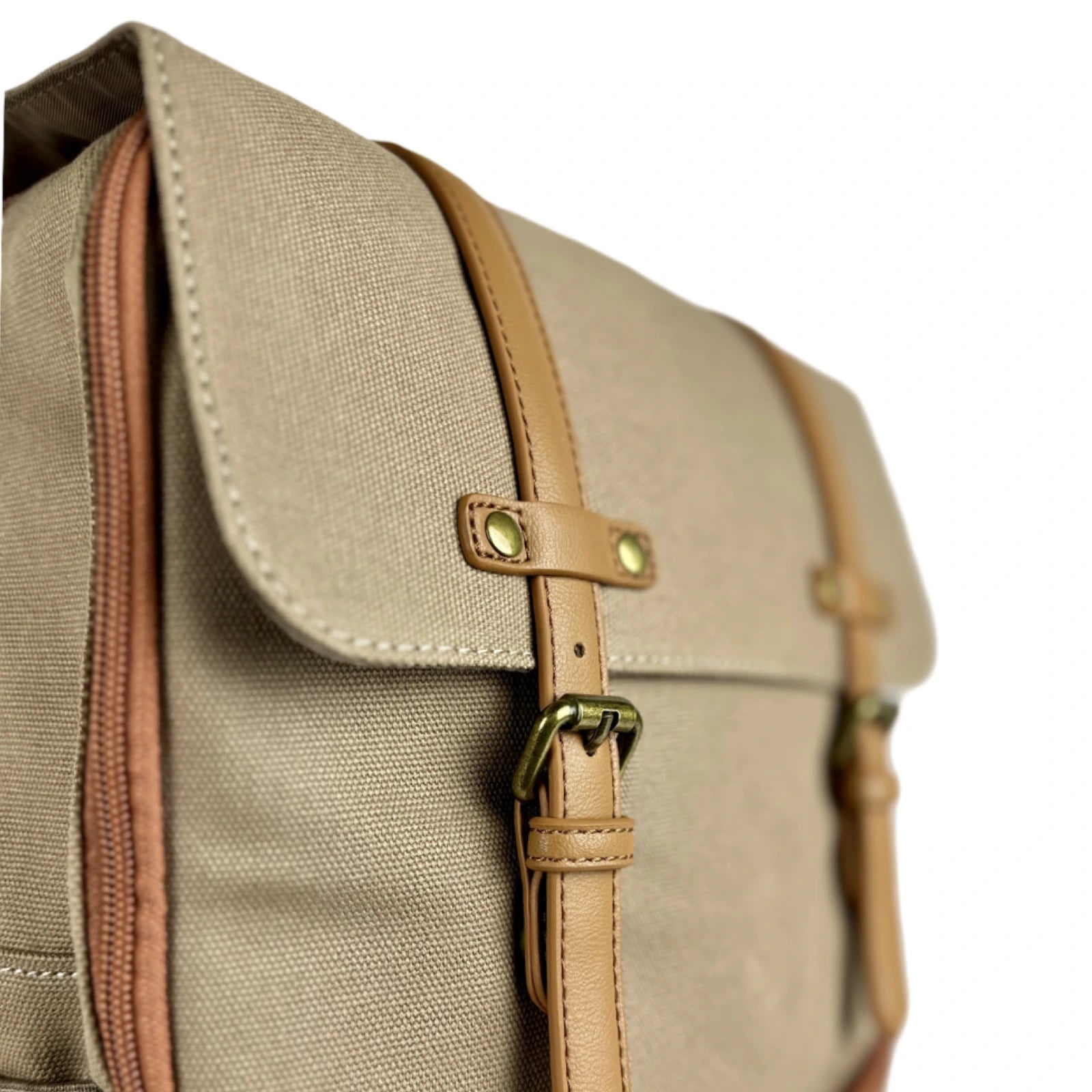 angled front view of details on canvas diaper bag backpack