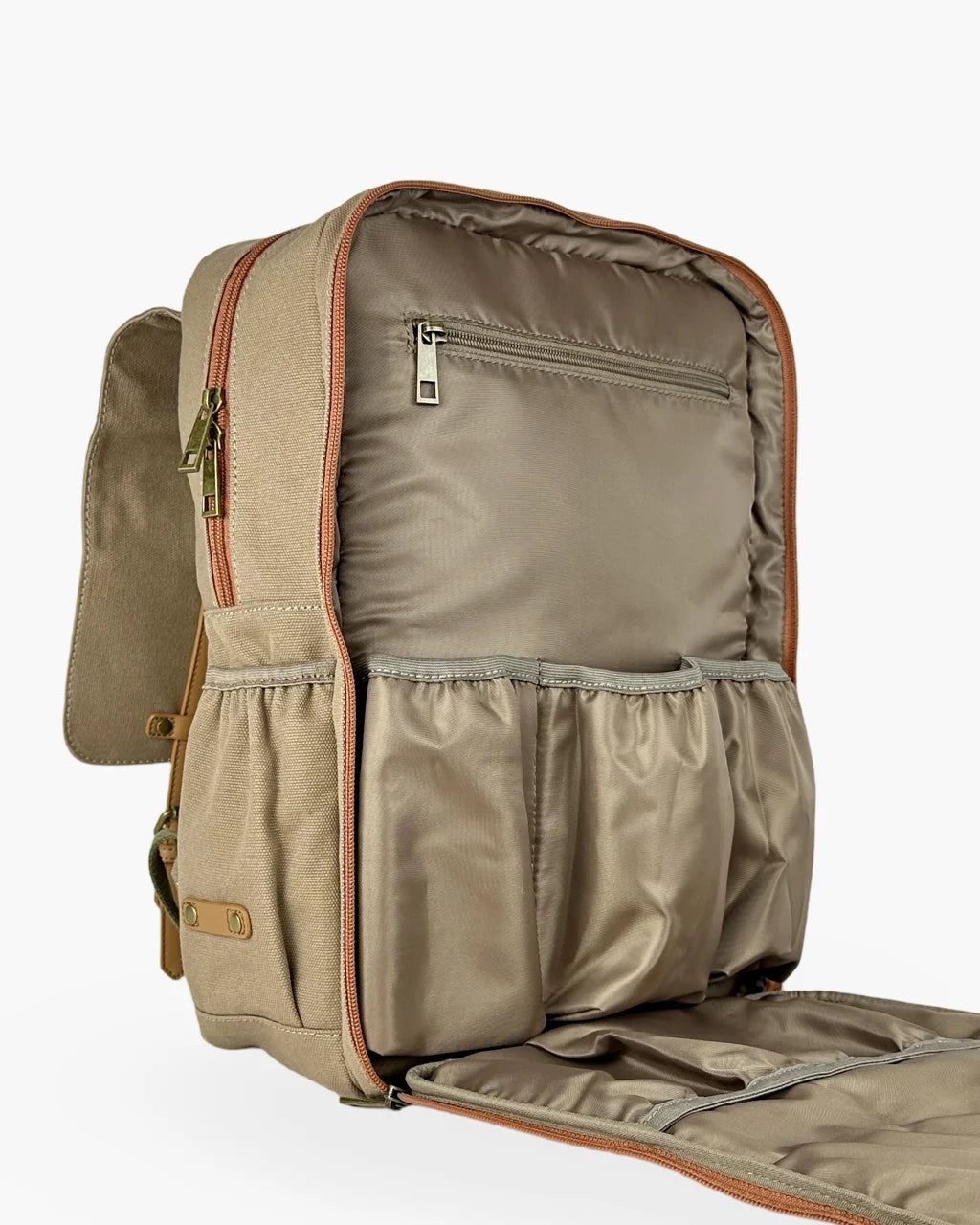 Open flap view of the beige canvas diaper backpack displaying its wide opening, spacious interior, and organizational compartments for practical use.