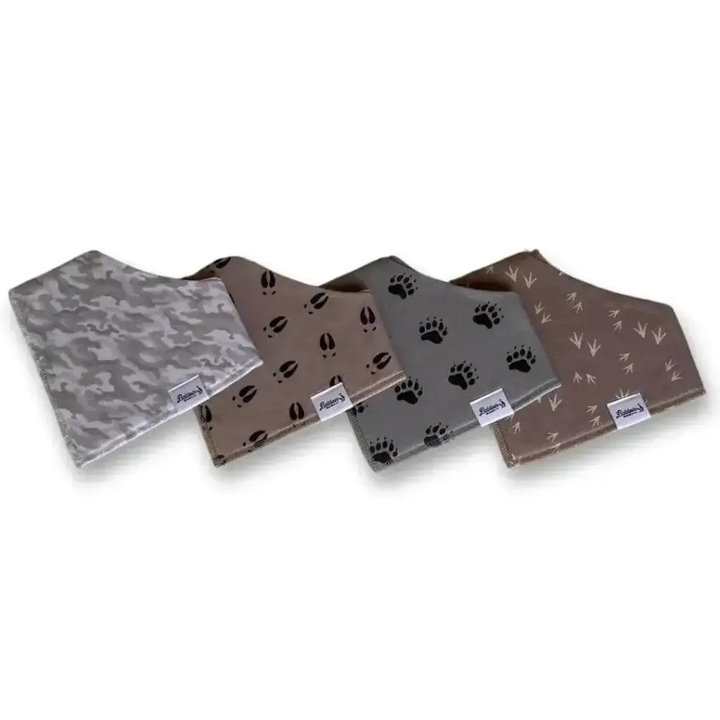 Set of four bandana bibs on a white background. Gray and white camo, tan with black deer tracks, gray with black bear paw tracks, and brown with tan turkey tracks patterns