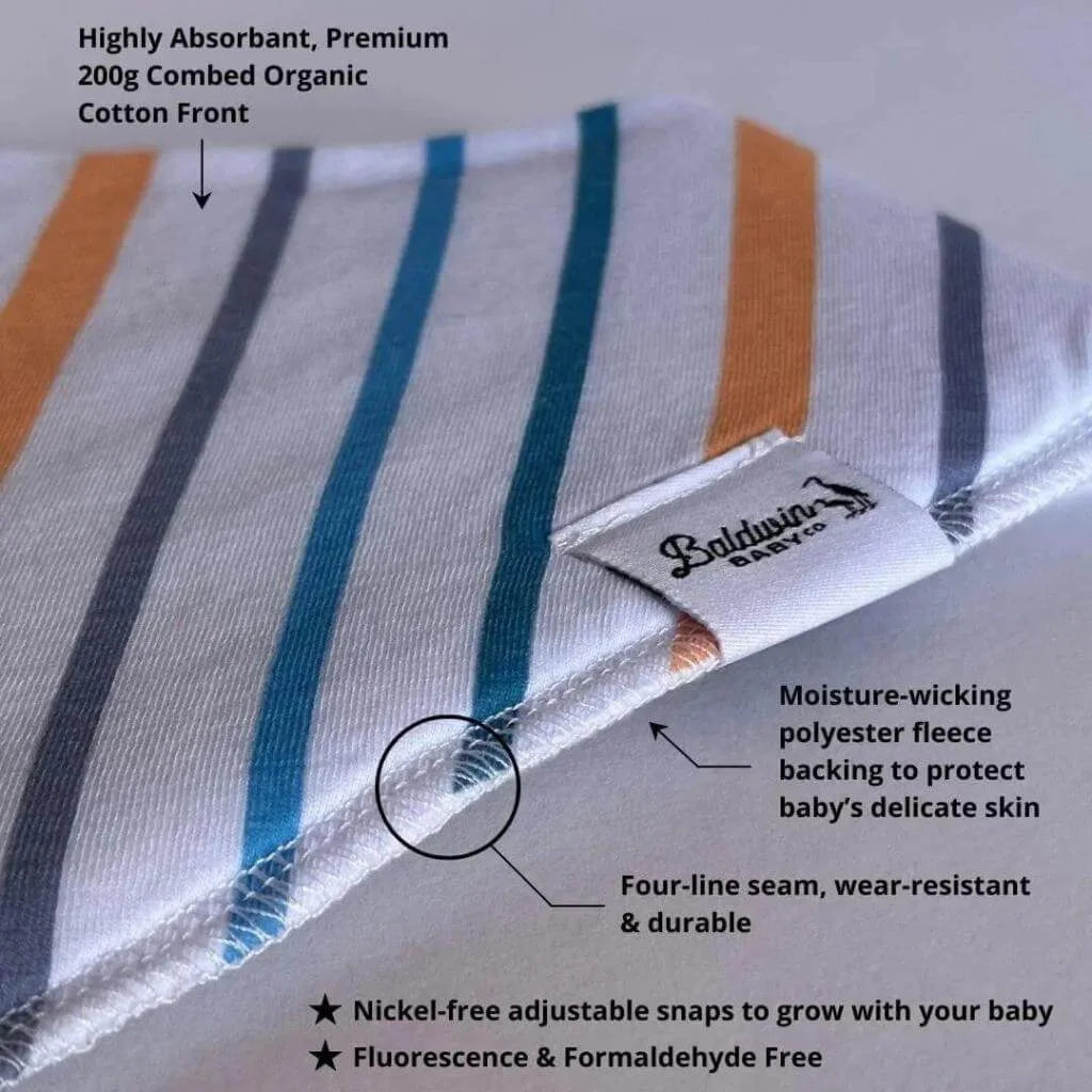 Close up of white, blue, gray, and orange striped pattern bandana bib with a white Baldwin Baby Company logo tag